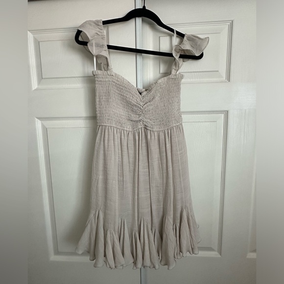 VICI Mahoney Smocked Ruffle Mini Dress in color sand - Picture 1 of 4